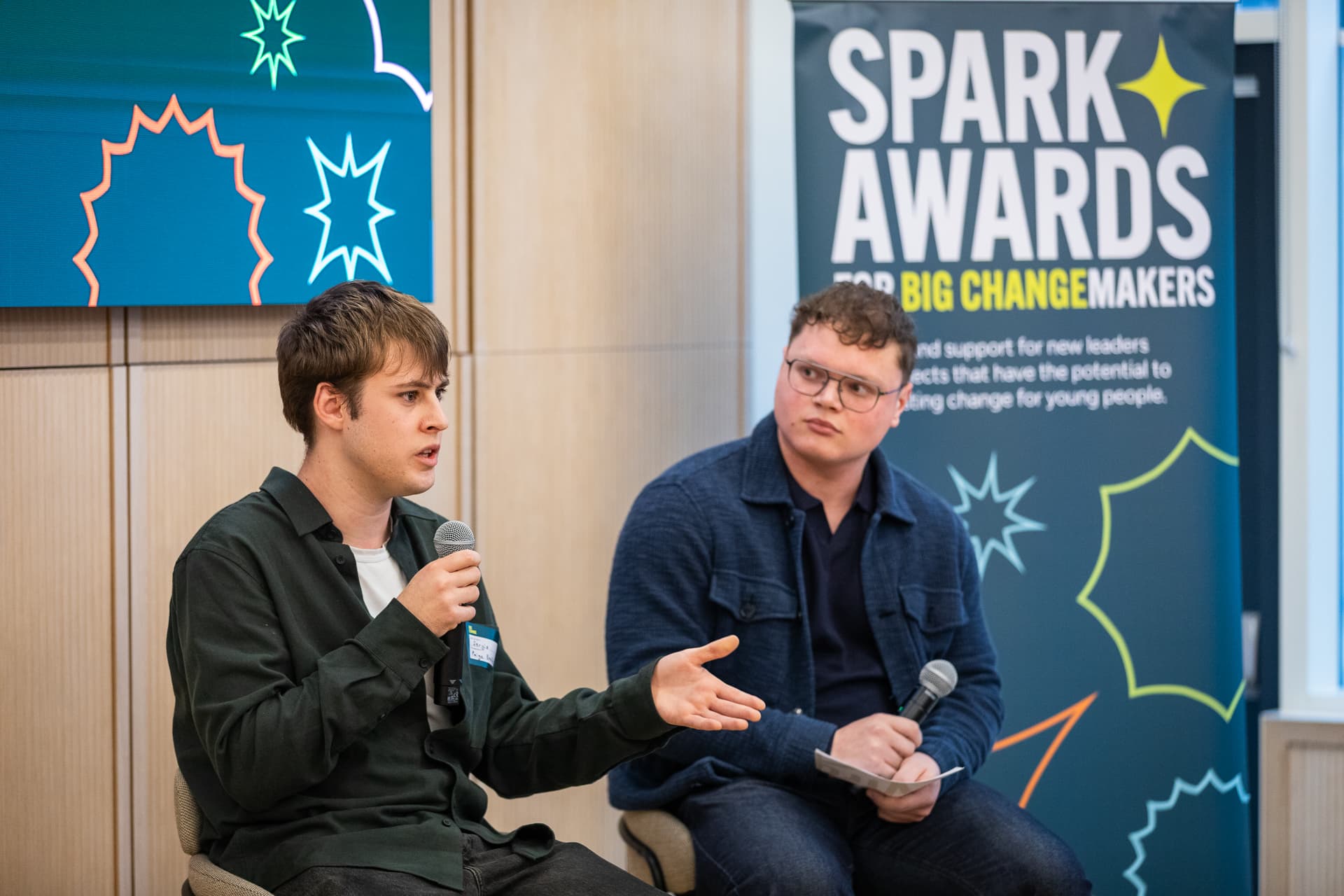 Two young people talking at the Sparks A